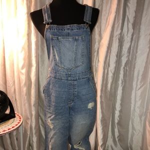 Cropped light wash overalls with rips